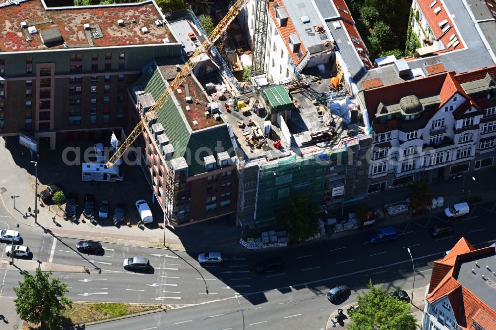Aerial image Berlin - Construction site for reconstruction and modernization and renovation of a building with the construction of a new roof on Schlossstrasse in the district Steglitz in Berlin, Germany