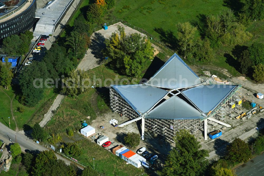 Magdeburg from the bird's eye view: Construction site for the renovation and reconstruction of the building of the former event hall Hyparschale on Heinrich-Heine-Weg in Magdeburg in the state Saxony-Anhalt, Germany