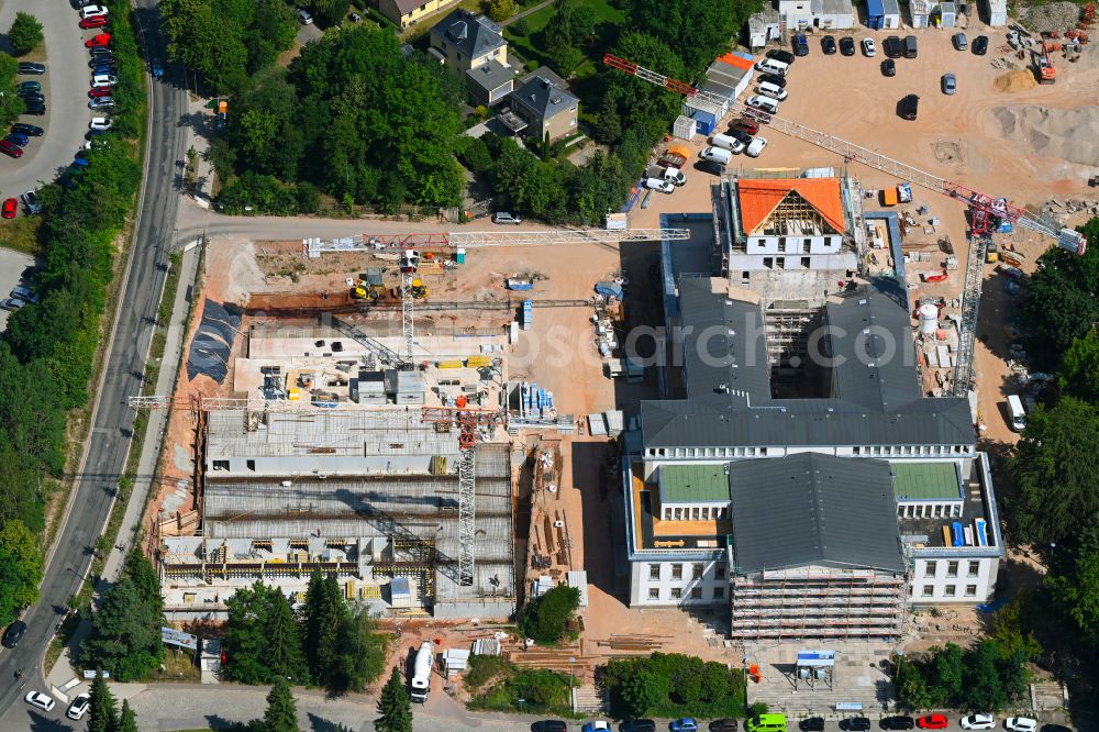 Chemnitz from above - Construction site for the renovation of the building of the event hall Kulturpalast Rabenstein (formerly Kulturpalast der Bergarbeiter) for conversion for residential purposes on Unritzstrasse in the district Reichenbrand in Chemnitz in the state Saxony, Germany