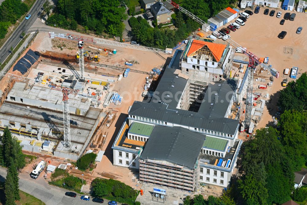 Chemnitz from the bird's eye view: Construction site for the renovation of the building of the event hall Kulturpalast Rabenstein (formerly Kulturpalast der Bergarbeiter) for conversion for residential purposes on Unritzstrasse in the district Reichenbrand in Chemnitz in the state Saxony, Germany