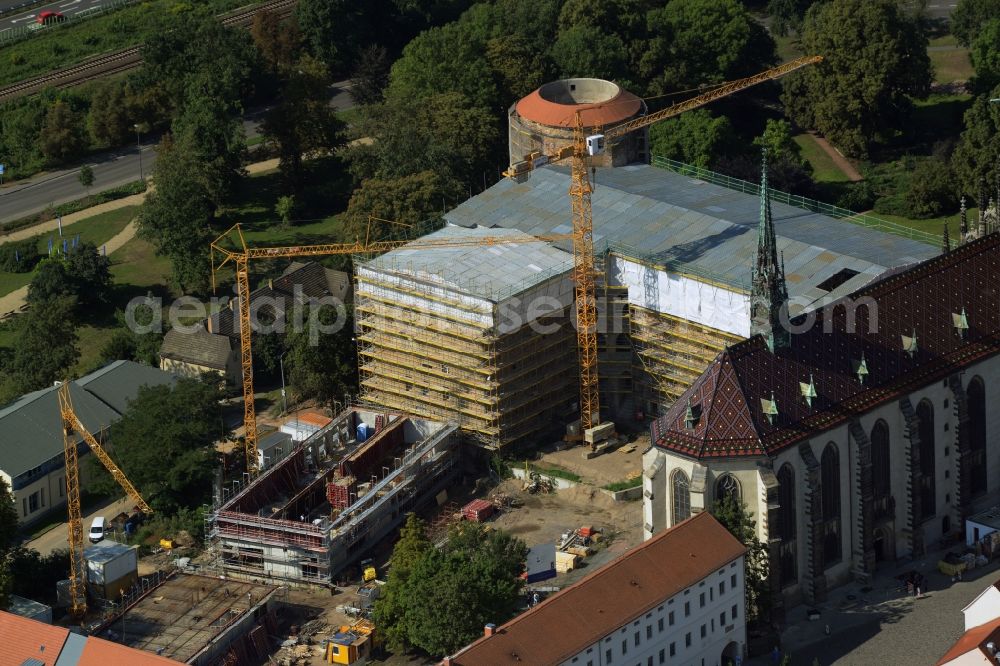 Aerial photograph Lutherstadt Wittenberg - View of the castle church of Wittenberg. The castle with its 88 m high Gothic tower at the west end of the town is a UNESCO World Heritage Site. It gained fame as the Wittenberg Augustinian monk and theology professor Martin Luther spread his disputation