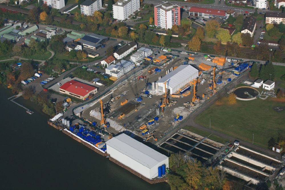Grenzach-Wyhlen from above - Remediation at the site of the former wastewater treatment plant of the pharmaceutical company Roche in Grenzach-Wyhlen in Baden -Wuerttemberg. The temporary landing stage on the river Rhine is used for the removal of the excavated material