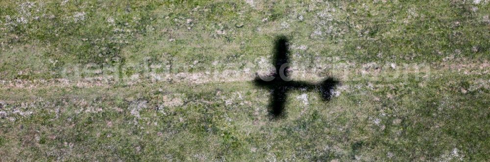 Aerial photograph Werneuchen - Shadow of the Cessna 172 D-EGYC of euroluftbild.de on grass at the airfield in Werneuchen in the state of Brandenburg