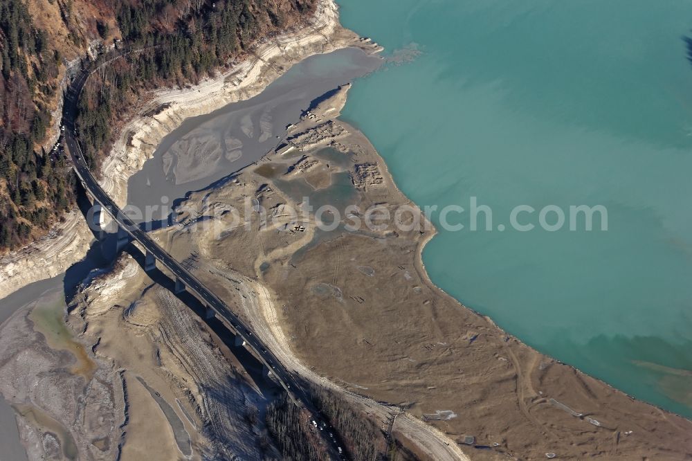 Aerial image Lenggries - Sightseers hikers in the ruins of the flooded village Fall at the bottom of the drained Sylvensteinstausees in Lenggries in the state Bavaria. To renew a service cap at the outlet of the reservoir, the water authority Weilheim had drained the water in autumn 2015. The Sylvensteinsee serves the flood protection