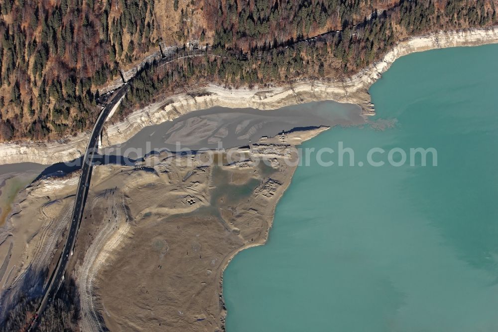 Aerial photograph Lenggries - Sightseers hikers in the ruins of the flooded village Fall at the bottom of the drained Sylvensteinstausees in Lenggries in the state Bavaria. To renew a service cap at the outlet of the reservoir, the water authority Weilheim had drained the water in autumn 2015. The Sylvensteinsee serves the flood protection