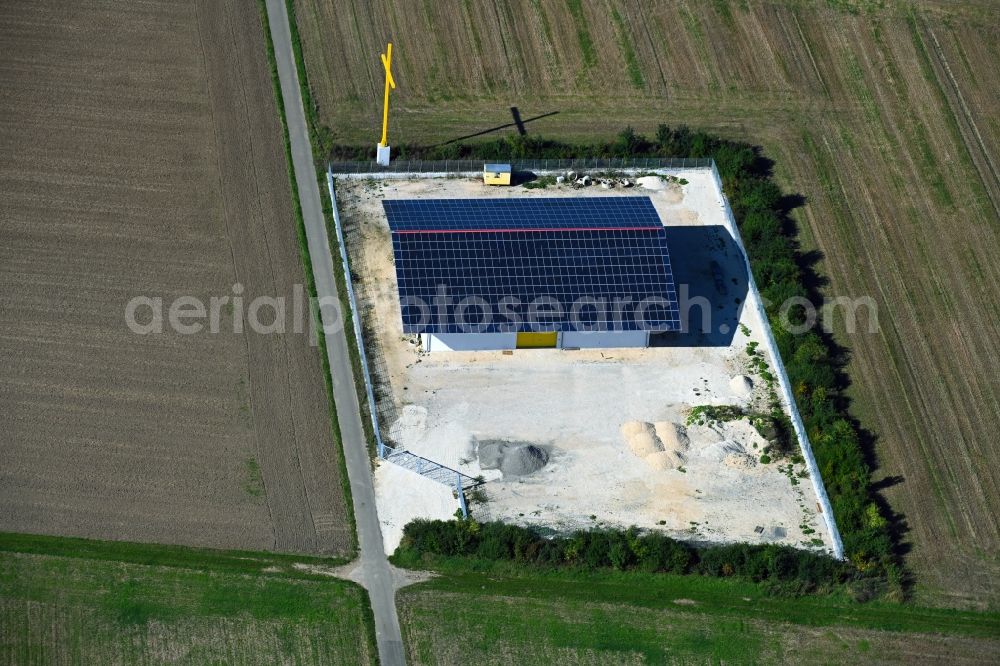 Hausen from above - Barn building on the edge of agricultural fields and farmland with yellow cross in Hausen in the state Bavaria, Germany