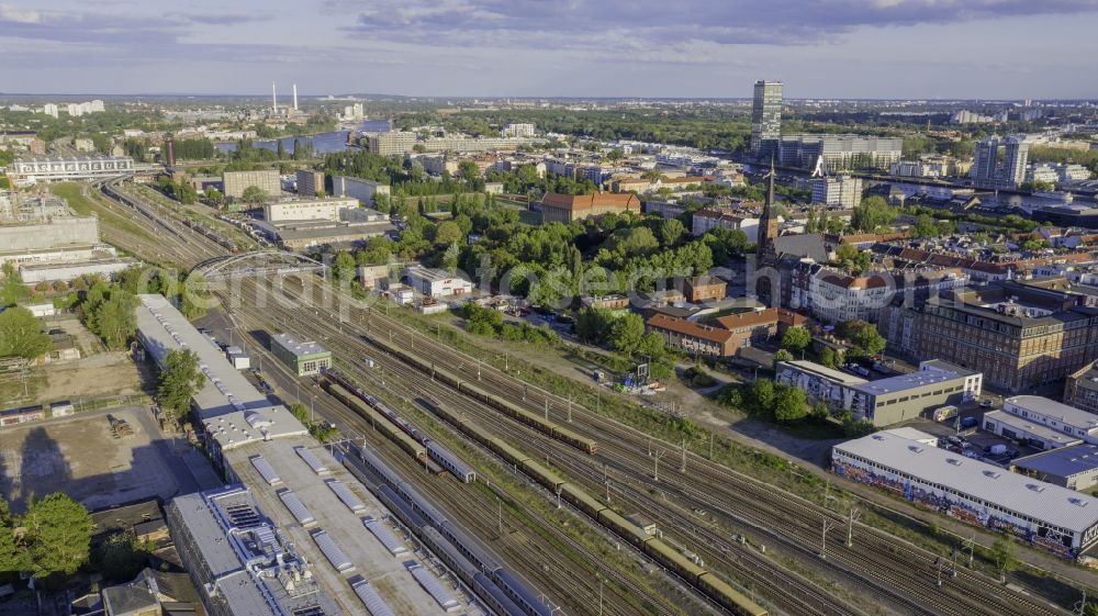 Berlin from above - Railway track and overhead wiring harness in the route network of the Deutsche Bahn overlooking the train station Berlin Ostkreuzin the district Friedrichshain in Berlin, Germany