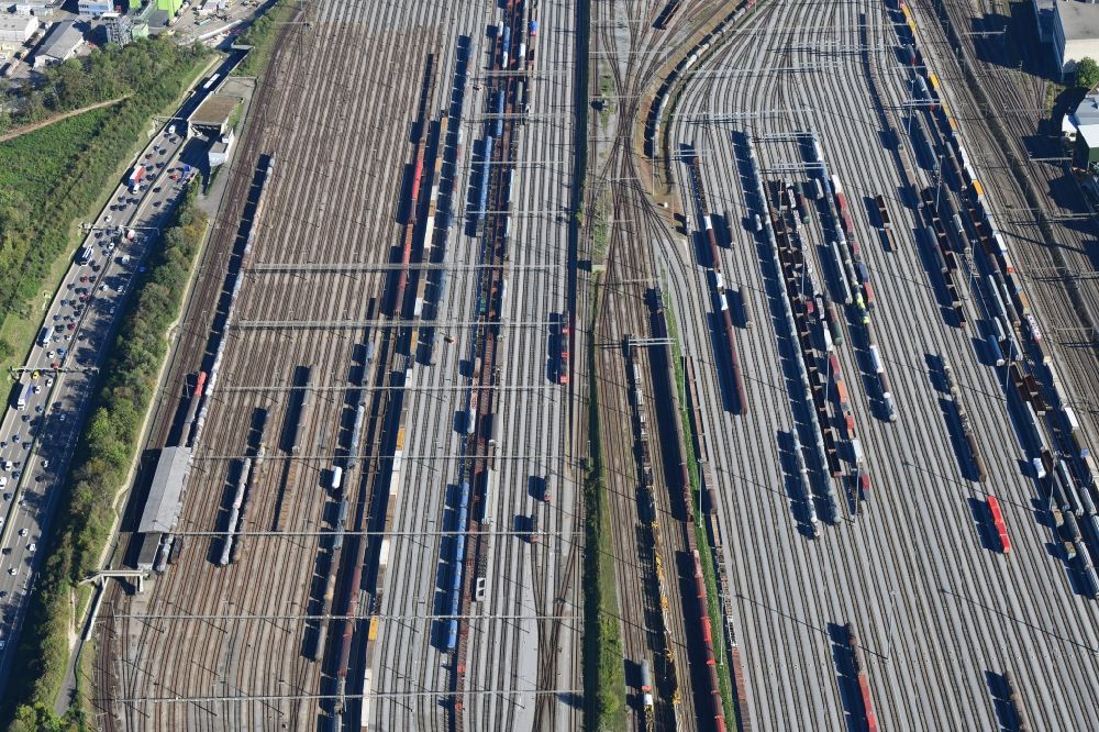 Aerial photograph Muttenz - Railway tracks and cargo trains in the route network of the Swiss Railway SBB in Muttenz in the canton Basel-Landschaft, Switzerland