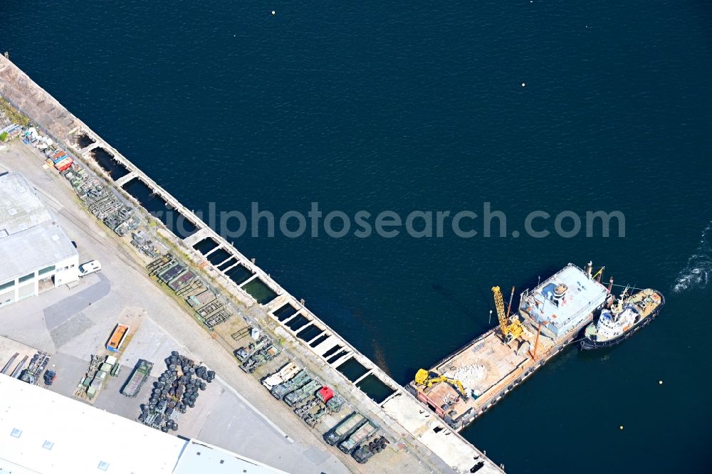 Flensburg from above - Ship - specialized vessel demolishes port facilities at the parking lot Parkplatz Phaenomenta on the Schiffbruecke in the port in Flensburg in the state Schleswig-Holstein, Germany
