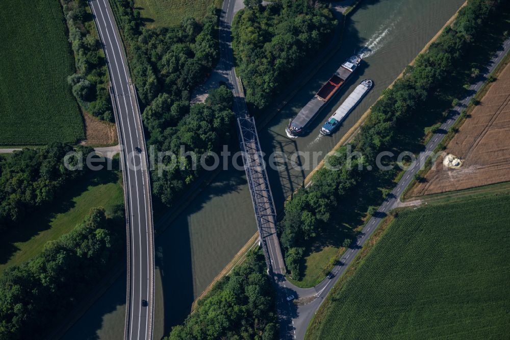 Braunschweig from the bird's eye view: Ships and barge trains inland waterway transport in driving on the waterway of the river Mittellandkanal in Brunswick in the state Lower Saxony, Germany