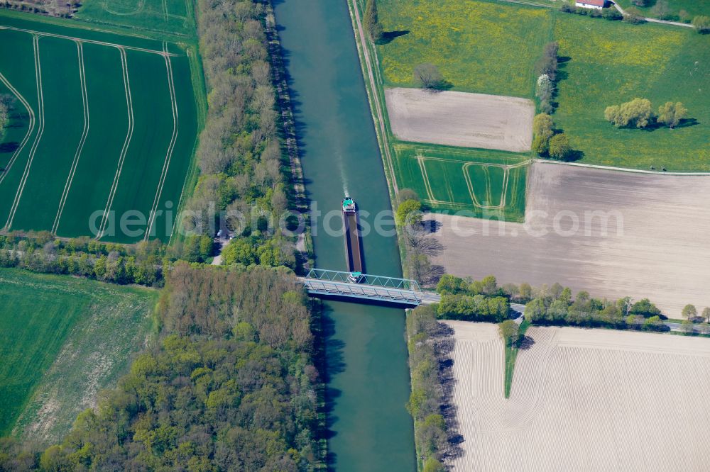 Aerial photograph Lübbecke - Ships and barge trains inland waterway transport in driving on the waterway of the river Mittellandkanal in Luebbecke in the state North Rhine-Westphalia, Germany