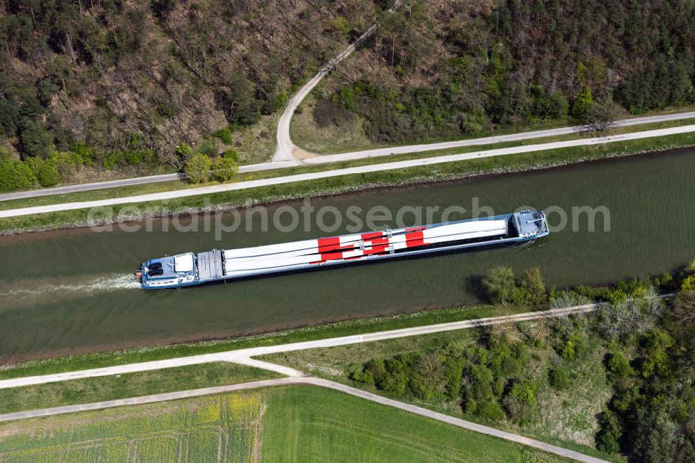 Bamberg from above - Ships and barge trains inland waterway transport in driving on the waterway of the river of Regnitz beladen with grossen Windrad Blaettern in Bamberg in the state Bavaria, Germany