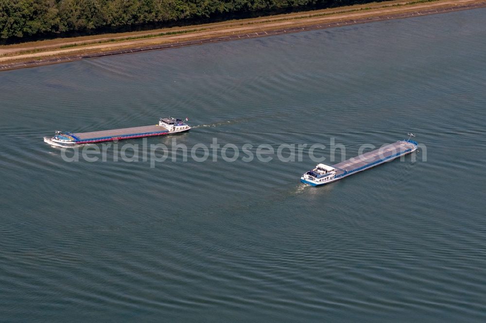 Aerial photograph Daubensand - Ships and barge trains inland waterway transport in driving on the waterway of the river Am Rhein bei gerstheim in Daubensand in Grand Est, France