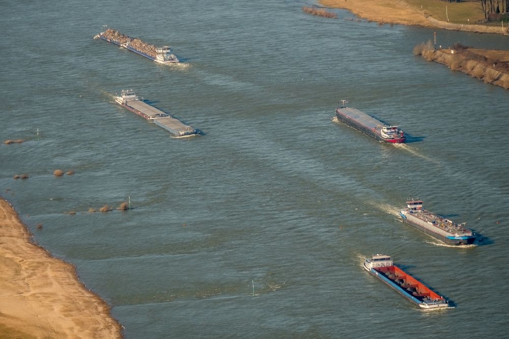 Duisburg from above - Ships and barge trains inland waterway transport in driving on the waterway of the river of the Rhine river in Duisburg in the state North Rhine-Westphalia, Germany
