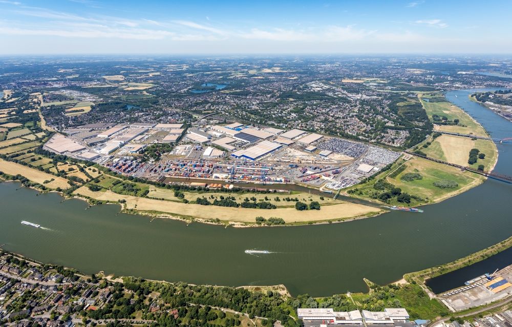 Duisburg from above - Ships and barge trains inland waterway transport in driving on the waterway of the river of the Rhine river overlooking the city center and industrial Estate in the inner city in Duisburg in the state North Rhine-Westphalia, Germany
