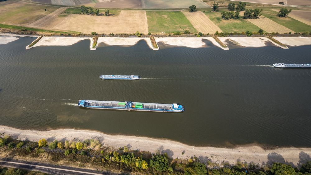 Aerial photograph Krefeld - Ships and barge trains inland waterway transport in driving on the waterway of the river of the Rhine river in Krefeld in the state North Rhine-Westphalia, Germany