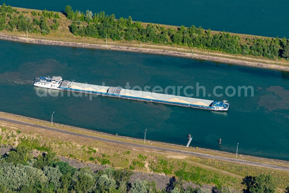 Aerial photograph Marckolsheim - Ships and barge trains inland waterway transport in driving on the waterway of the river on Rhein in Marckolsheim in Grand Est, France