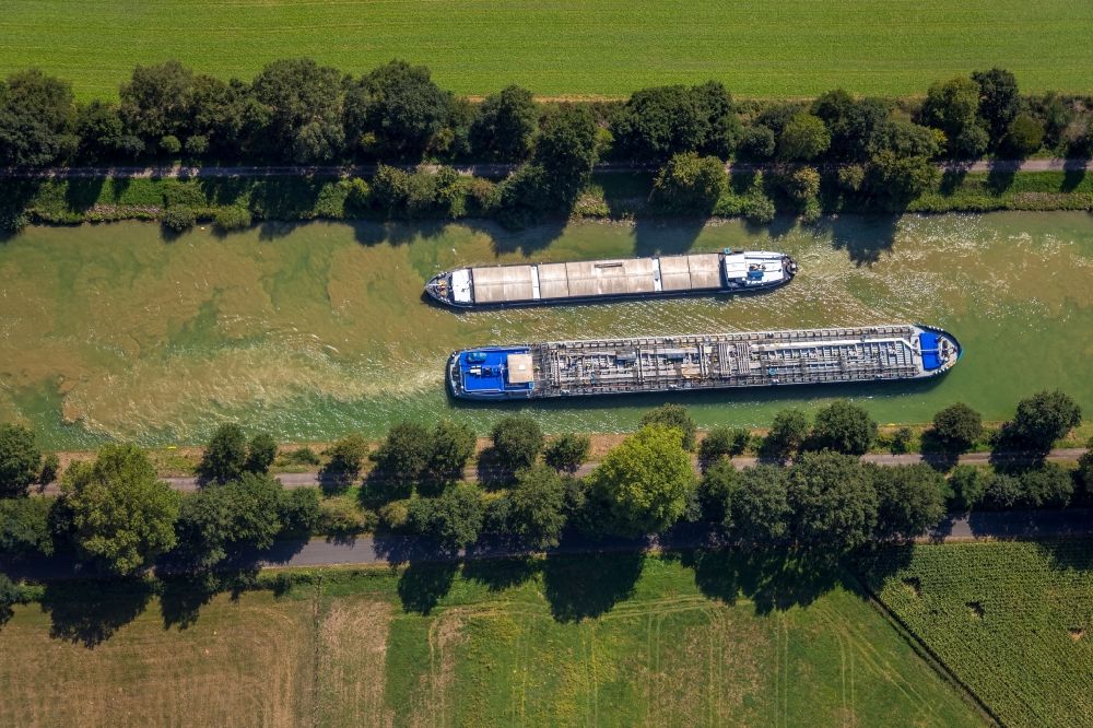Aerial image Hünxe - Ships and barge trains inland waterway transport in driving on the waterway of the river on Wesel-Datteln-Kanal in Huenxe in the state North Rhine-Westphalia, Germany