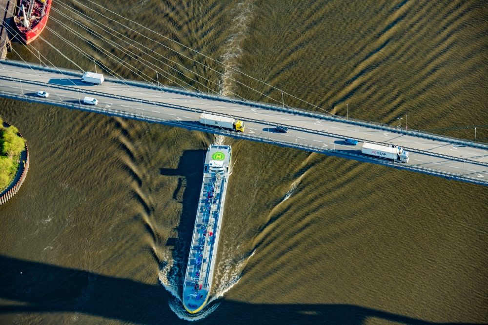 Hamburg from above - Ships and tug formations of the inland navigation in operation on the waterway of the river Elbe under the Koehlbrandbruecke in the district Waltershof in Hamburg, Germany