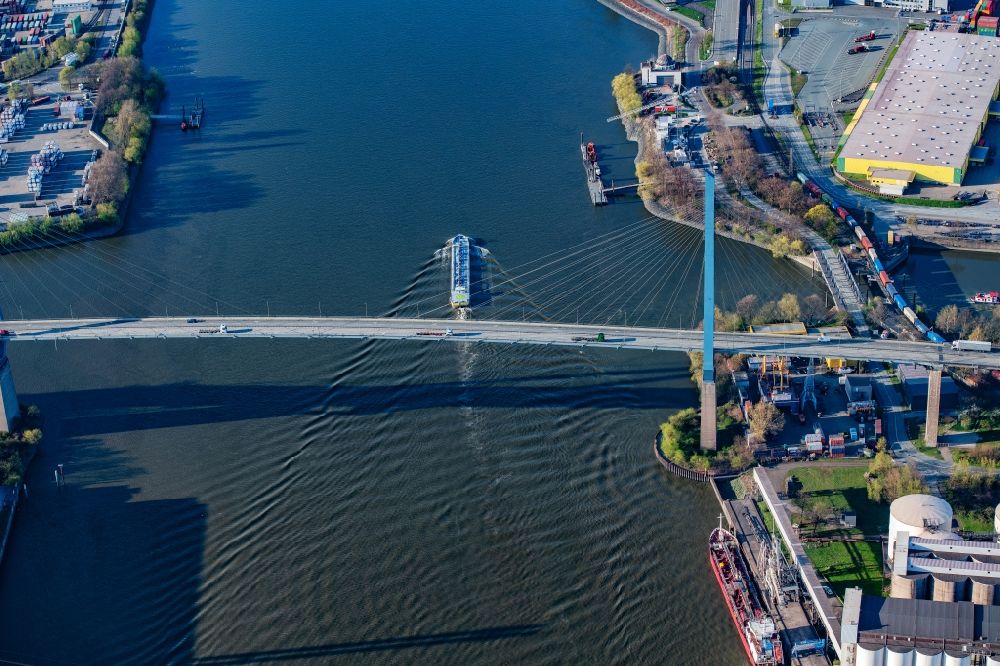 Aerial photograph Hamburg - Ships and tug formations of the inland navigation in operation on the waterway of the river Elbe under the Koehlbrandbruecke in the district Waltershof in Hamburg, Germany