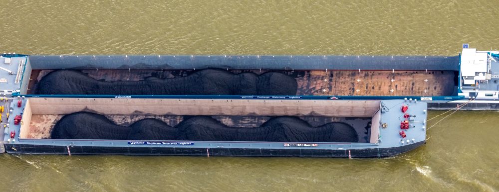 Rees from above - Ships and tugboats of inland navigation with reduced loads in the narrowed due to drought and low water level fairway on the waterway on the Rhine river in Rees in the state North Rhine-Westphalia, Germany