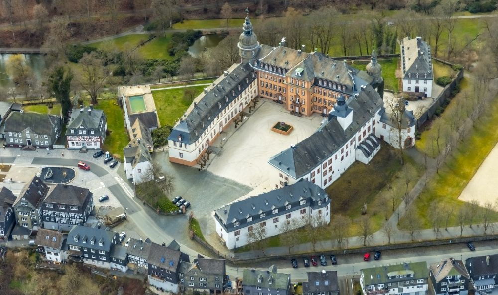 Bad Berleburg from above - Castle Berleburg in Bad Berleburg in the county district Siegen-Wittgenstein in the state of North Rhine-Westphali. The castle is now owned by the family Sayn-Wittgenstein-Berleburg and is used as a museum