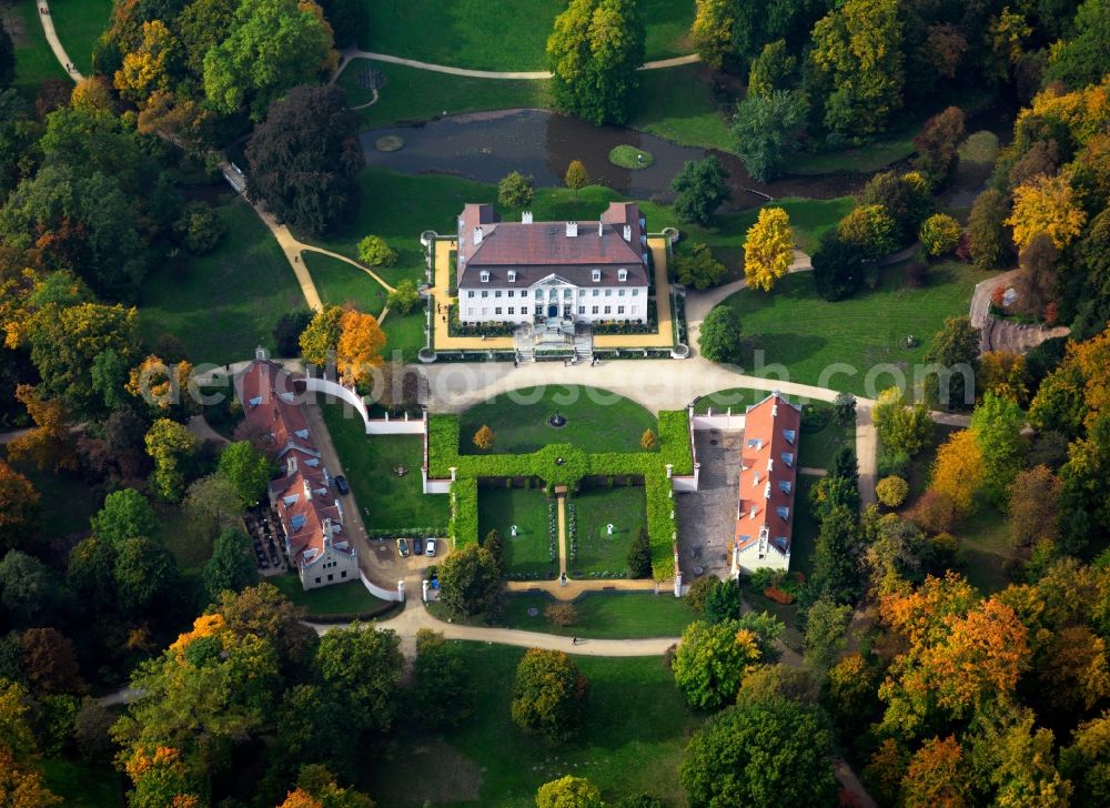 Aerial image Cottbus - Branitz Castle in the Branitz part of Cottbus in the state of Brandenburg. The palais is located in the centre of the landscape park of Count Pueckler and was built 1770-1772 in the baroque style and brought into its current shape in 1850. Today, it is a museum. It is surrounded by historic outbuildings and a hedge garden. The large park itself is famous for its earth pyramids