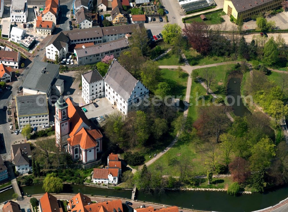 Krumbach from the bird's eye view: Castle Krumbach in Krumbach in the state of Bavaria. The castle and the adjacent catholic town church St.Michael form the town's important sites. The castle is a three story Renaissance building with a gabel roof and battlements. Originally conceived as a fortress, it today includes an academy for social pedagogy