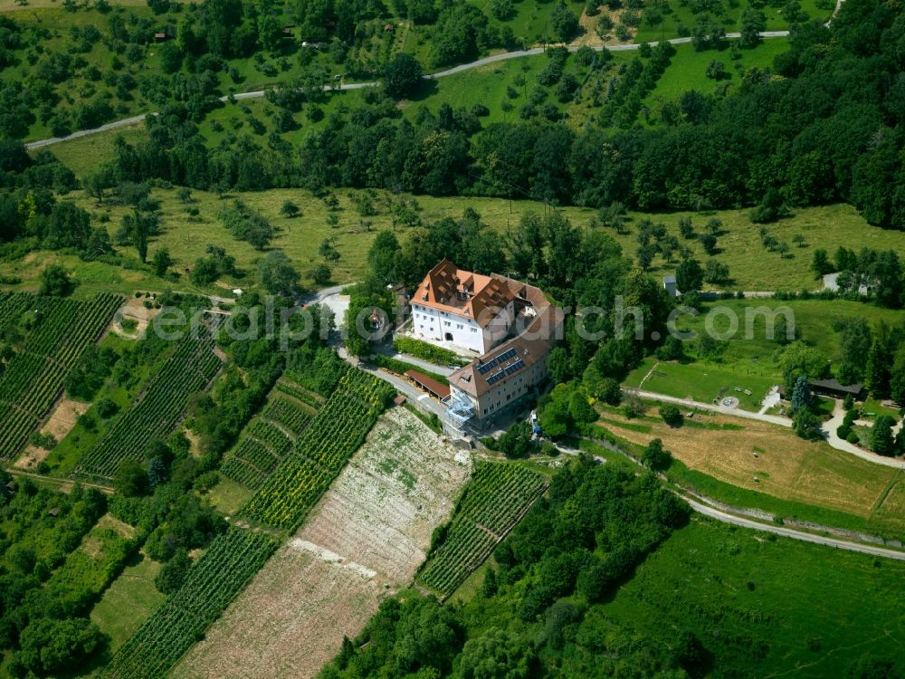 Aerial image Tübingen - Castle Roseck in the Schoenbuch region of the state of Baden-Wuerttemberg. The castle is located on a hill with vineyards and surrounded by forest. It sits above the Ammer Valley, north of Unterjesingen. The former fortress was first mentioned in 1287. During its history, it has been used as a monastery, a manor and as accommodation for asylum-seekers. Since 2014, it is Wolfgang Gerberely owned