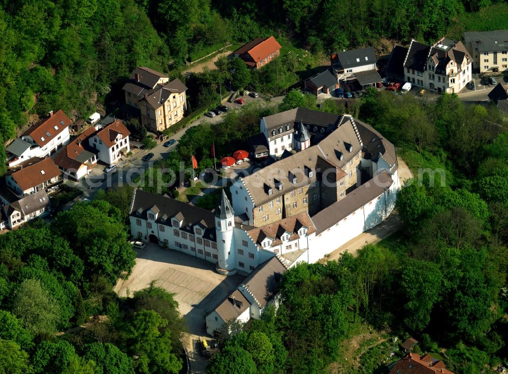 Bensheim from the bird's eye view: Castle Schoenberg in the Schoenberg part of Bensheim in the state of Hesse. The castle is located on Bergstrasse. It was originally built in the 13th century as a fortress on a mountain above Schoenberg. The castle was closed in 2011 and is now available for sale