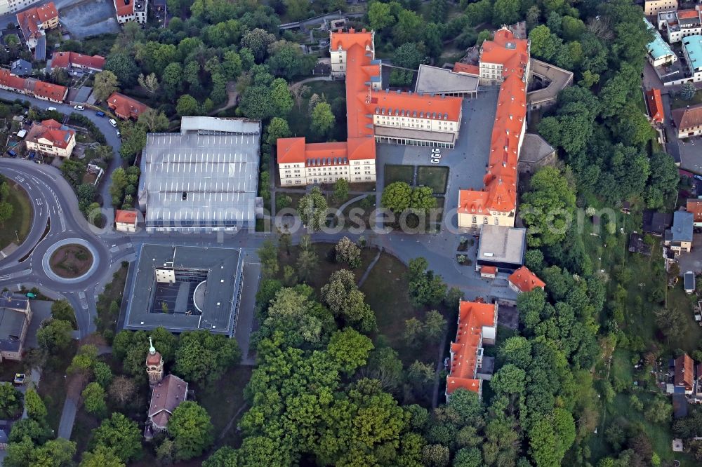 Aerial photograph Pirna - Sonnenstein Castle in Pirna in the state Saxony, Germany, was first mentioned in the 13th century. Today it is one of the most important landmarks high above the old town of Pirna. It has a long and eventful history. So it was over the centuries castle, garrison, hospital and popular enterprise. Today it is open to tourists and administrative headquarters of the district of Saxon Switzerland-Osterzgebirge