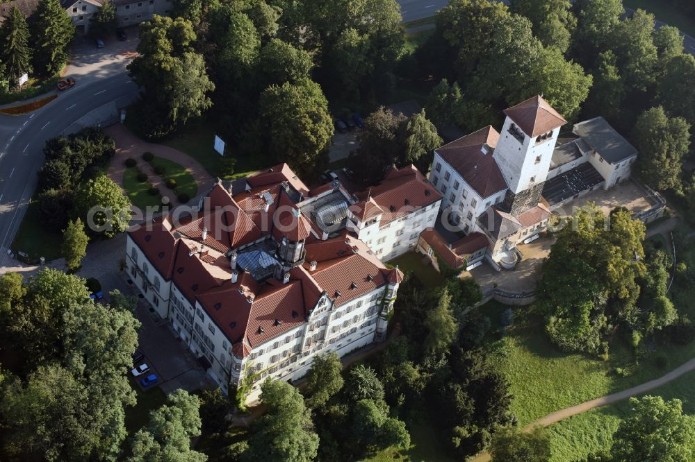 Waldenburg from above - Castle Waldenburg in Waldenburg in the state of Saxony. The castle with its castle keep is surrounded by forest and located on a hill in the Southeast of Waldenburg