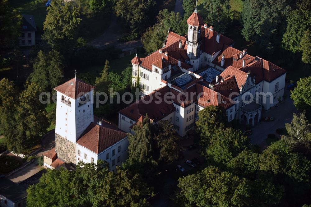 Waldenburg from above - Castle Waldenburg in Waldenburg in the state of Saxony. The castle with its castle keep is surrounded by forest and located on a hill in the Southeast of Waldenburg
