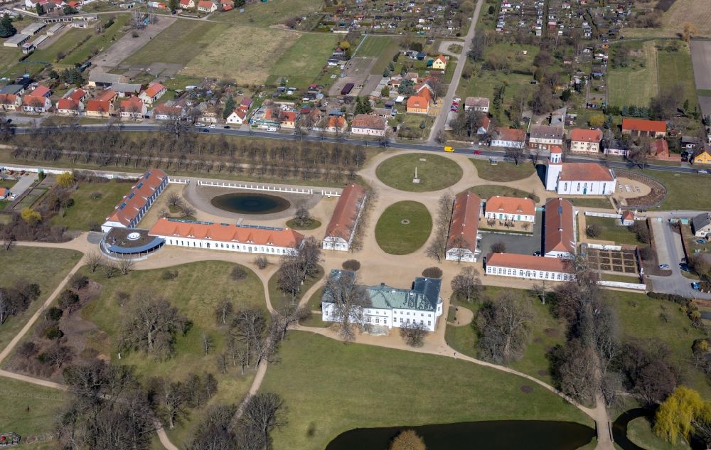 Aerial image Neuhardenberg - Views of the Castle Hotel and the Schinkel Church in Neuhardenberg in the Federal State of Brandenburg. The Stiftung Schloss Hardenberg new GmbH is a wholly owned subsidiary of the German savings banks Association (DSGV) and was founded in 2001, around the DSGV bought and extensively renovated and refurbished Castle as a Center for culture, art, science and business ethics with a five-star hotel and rooms for meetings, to conferences and events
