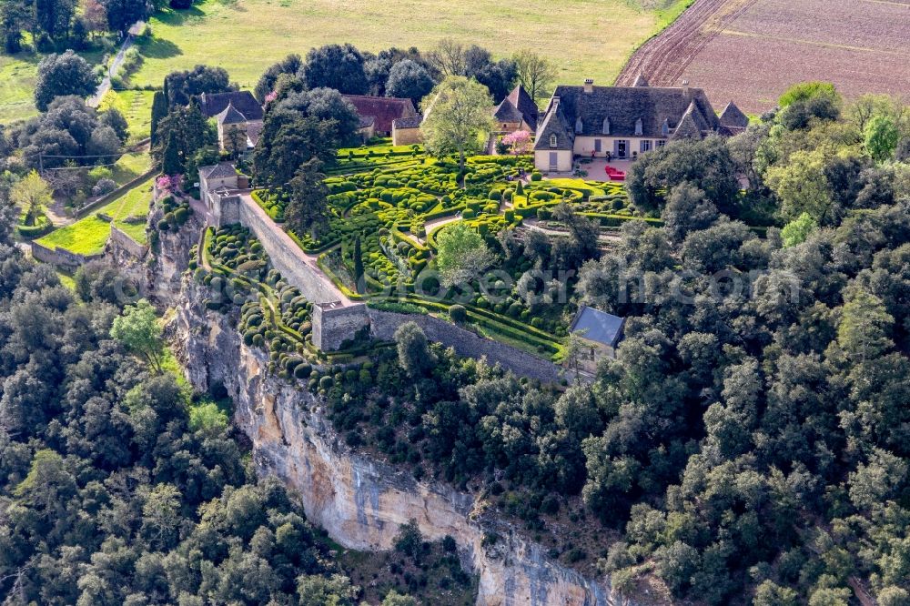 Aerial image Vezac - Park and gardenss of the castle Marqueyssac above the Dordogne in Vezac in Nouvelle-Aquitaine, France