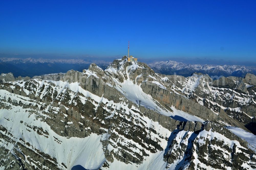 Säntis from the bird's eye view: Snow veiled mountain range Santis - Mountain in the Appenzell Alps in Switzerland
