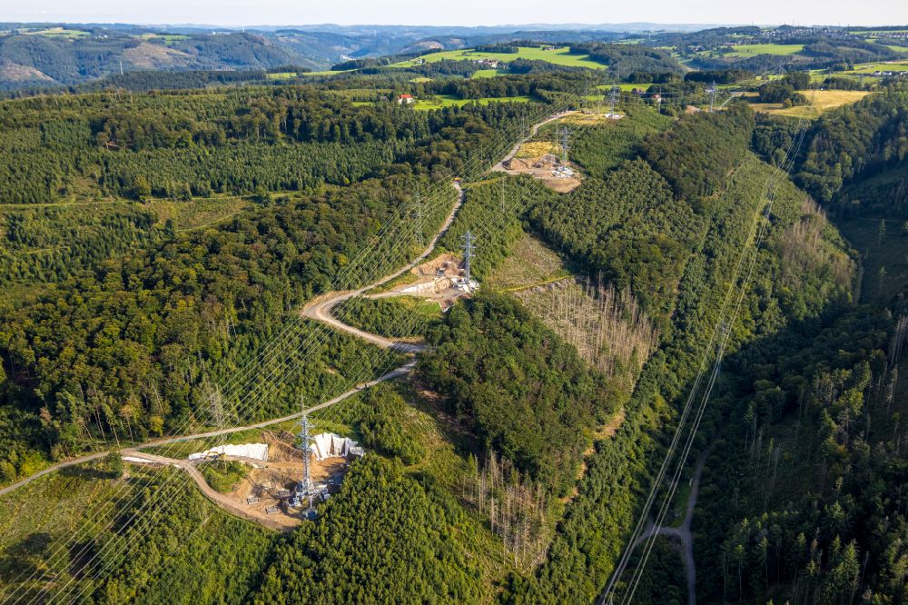 Hohenlimburg from above - Current route of the power lines and pylons over a forest area in Hohenlimburg at Ruhrgebiet in the state North Rhine-Westphalia, Germany