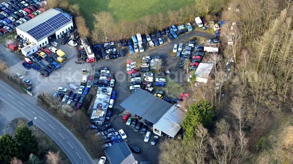 Aerial photograph Krautscheid - Scrapyard for recycling of cars cars and used vehicles with decomposition and aftermarket Autoverwertung Becher on street Krautscheider Strasse in Krautscheid in the state Rhineland-Palatinate, Germany