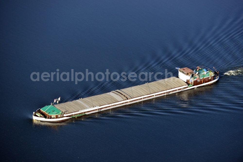 Aerial photograph Groß Kreutz - View of a bulk carrier in Groß Kreutz in the state Brandenburg. The freighter bears the name Iranda and is travelling on the river Havel