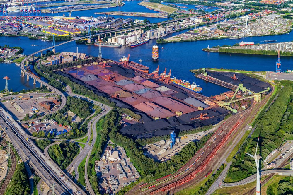 Hamburg from the bird's eye view: Wharves and jetties marine inland waterway with loading of building materials, coal, earth, gravel, stones or other materials in the inner harbor in the district Altenwerder in Hamburg, Germany
