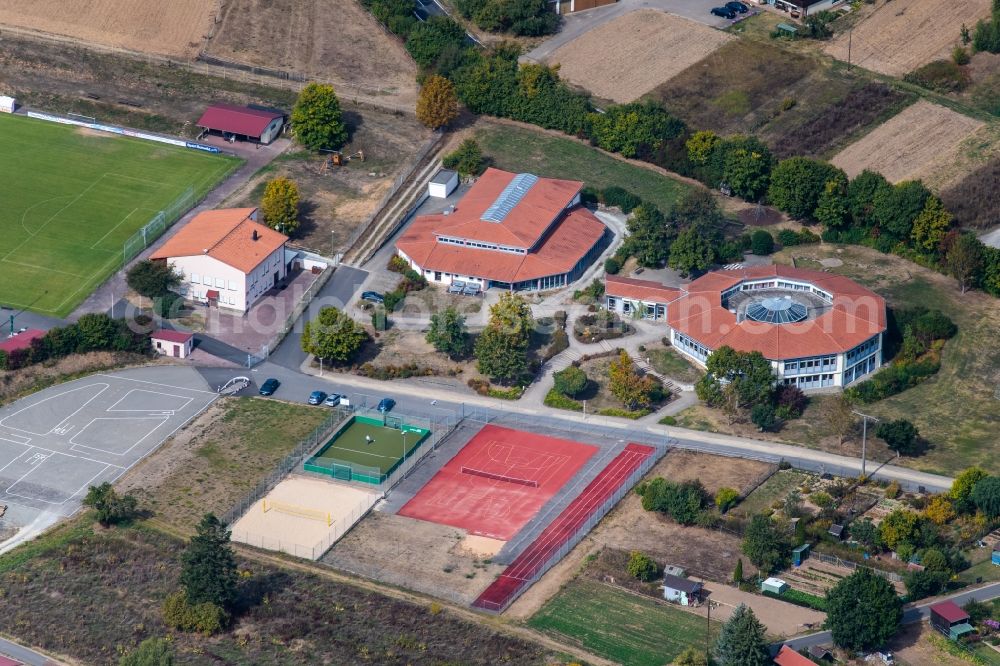 Steinfeld from above - School building of the Grundschule Steinfeld overlooking the sports ground ensemble of SV Steinfeld 1931 e.V. on Waldzeller Strasse in Steinfeld in the state Bavaria, Germany
