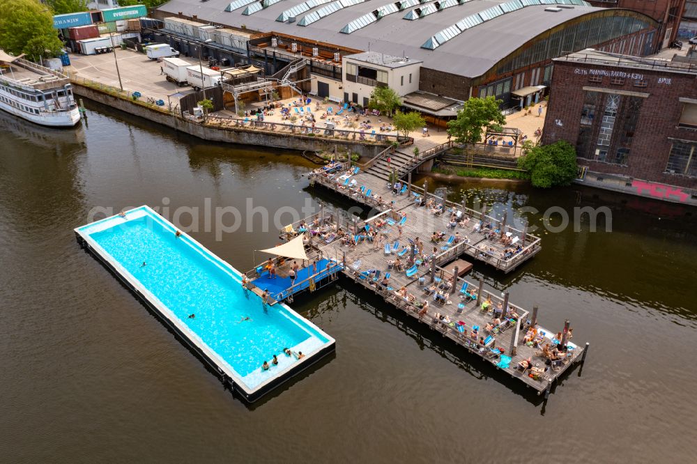 Berlin from above - Swimming pool of the Badeschiff on river Spree on Eichenstrasse in the district Treptow in Berlin, Germany
