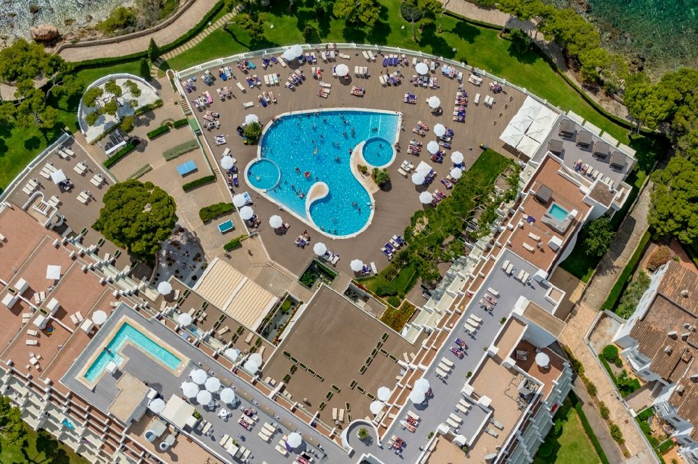 Palmanova from above - Refreshing swim in the blue pool - swimming pool on the roof of the hotel building of the Aparthotel Ponent Mar on Carrer MarquA?s de la Torre in Palmanova in Balearic island of Mallorca, Spain