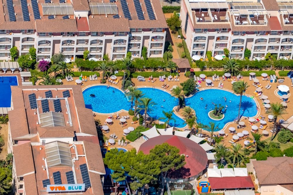 Aerial photograph Playa de Muro - Refreshing swim in the blue pool - swimming pool of the hotel VIVA Blue & Spa on Carrer Passeig de Bateman in Playa de Muro in Balearic island of Mallorca, Spain