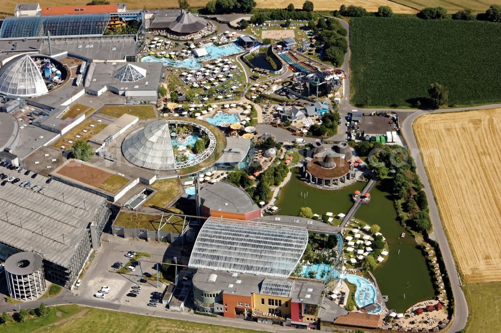 Erding from the bird's eye view: Spa, Swimming pools and water slides at the indoor and outdoor pools of the Therme Erding in the state Bavaria. Glass roof and metal domes are open and allow a view of the slide paradise Galaxy, indoor pool, wave pool, vitality oasis and other wellness areas
