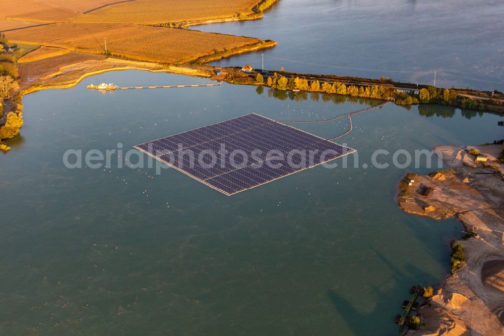 Aerial image Leimersheim - Floating solar power plant and panels of photovoltaic systems on the surface of the water on a quarry pond for gravel extraction in Leimersheim in the state Rhineland-Palatinate, Germany