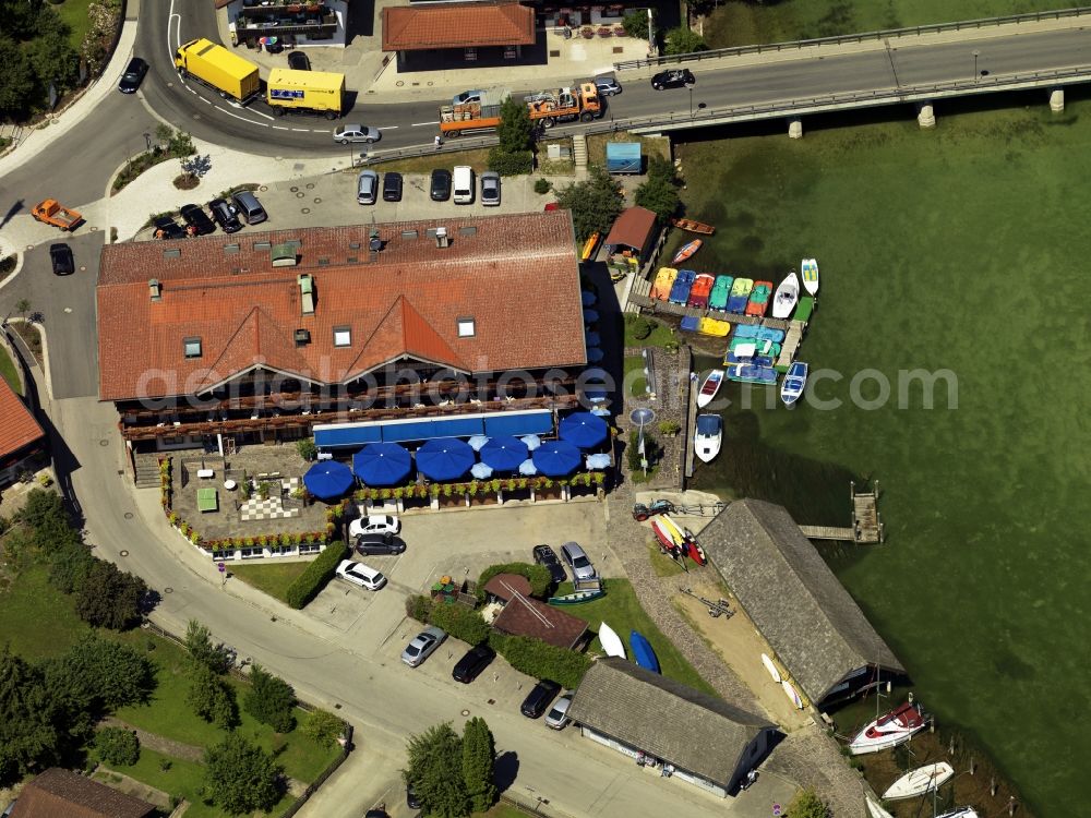 Seeon-Seebruck from above - Lake Hotel Wassermann in Seeon-Seebruck in the state of Bavaria. The hotel is located on the bridge which connects Seebruck with Graben across the river Alz. The hotel on the Northern shore of Lake Chiemsee has its own boat dock