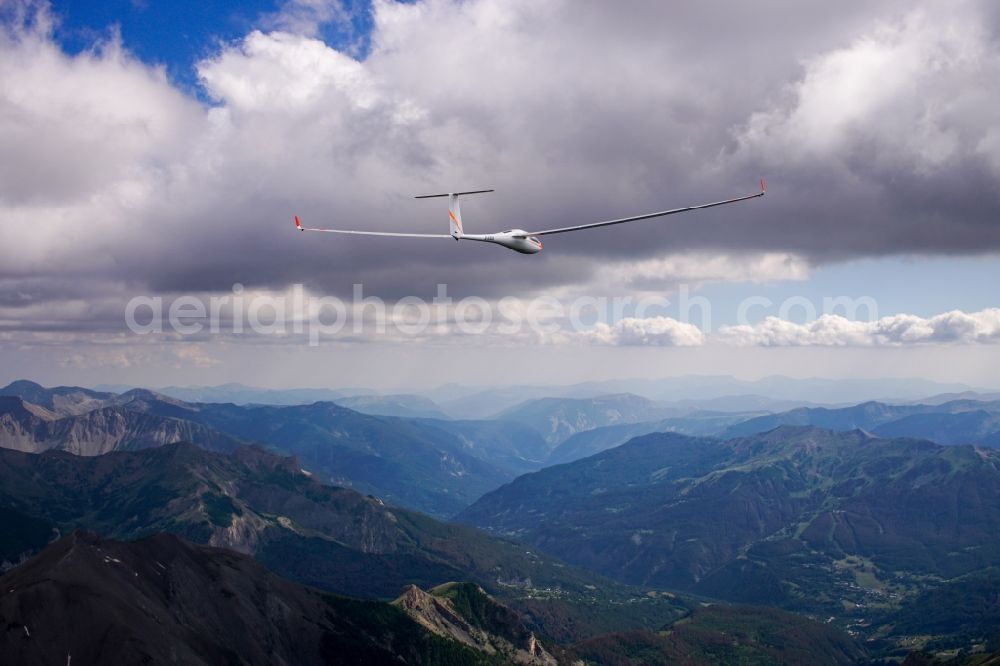 Vars from the bird's eye view: Glider and sport aircraft ASH26 D-KRLH flying above the pass Col de vars in Vars in Provence-Alpes-Cote d'Azur, France