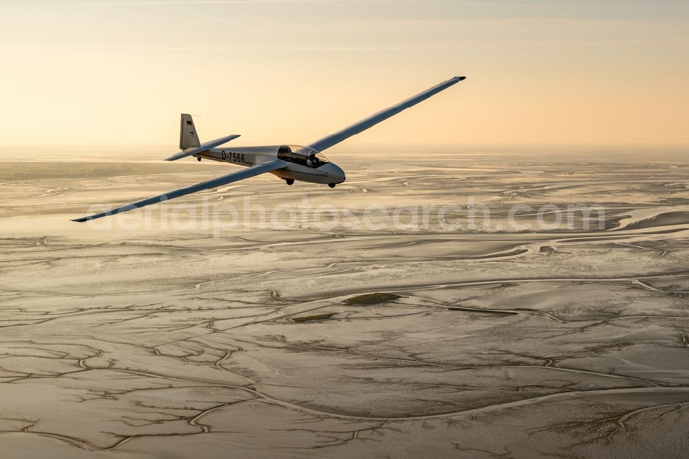 Nordenham from above - Glider and sport aircraft ASK-13 flying over the airspace of structure of Waddensea in Nordenham in the state Lower Saxony, Germany