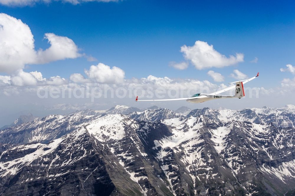 Aerial image La Chapelle-en-Valgaudémar - Glider and sport aircraft ASW 20 D-6538 flying over the mountains of the Ecrins national park in Provence-Alpes-Cote d'Azur, France
